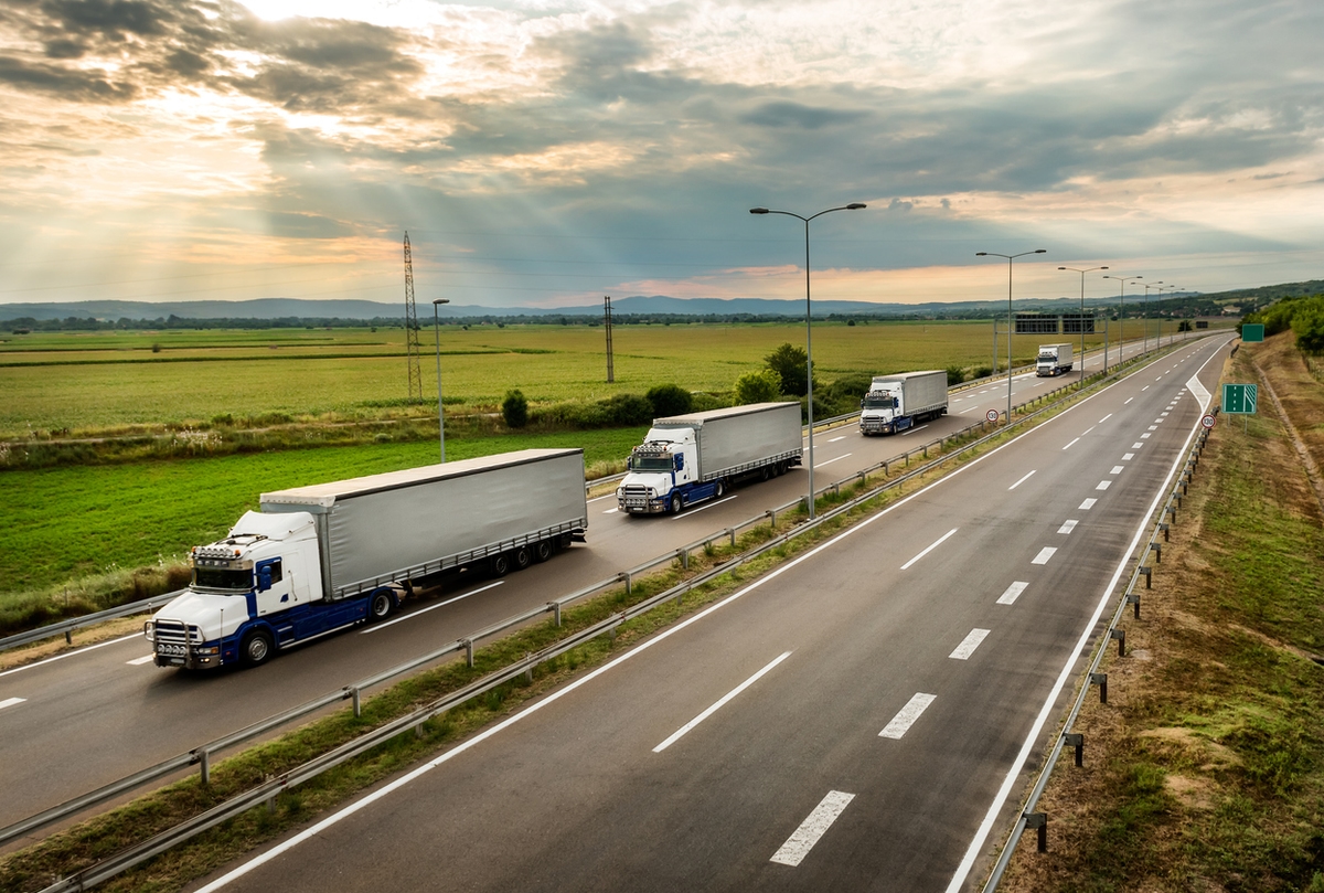Lorry trucks in line on a country highway
