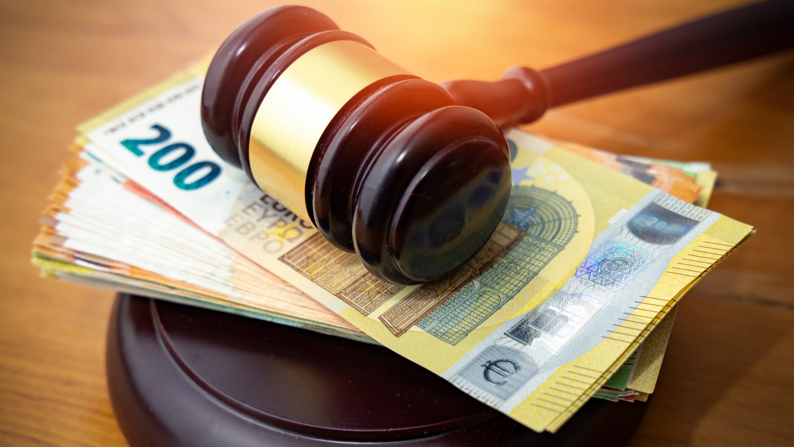 Judge gavel with euro bills
