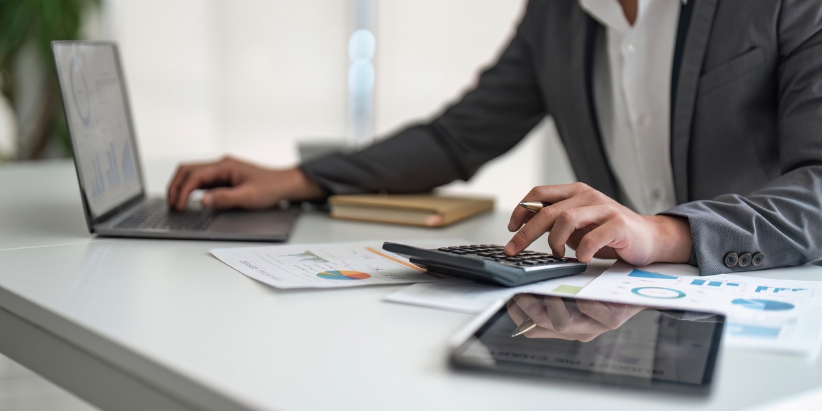 Young asian business man audit analysis graph company budget report, assigned accounts receivable, production control, operational audit, cost plus pricing
