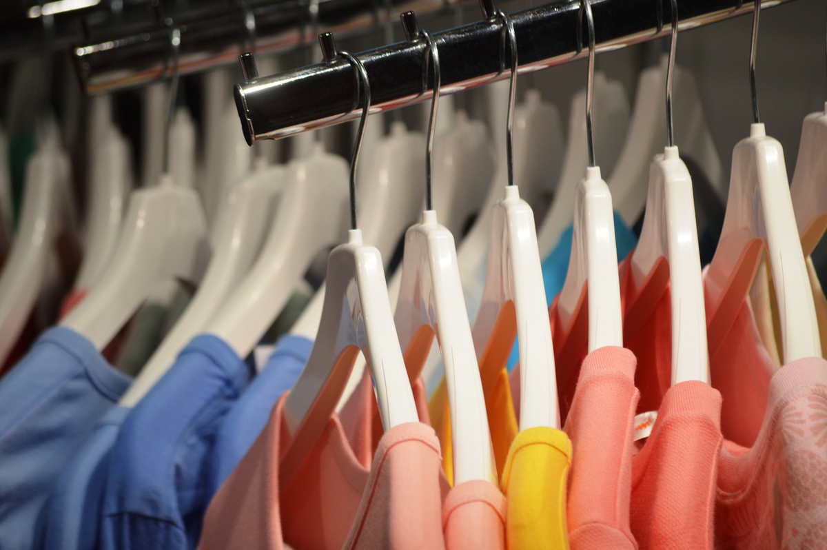 clothes in a store on the shelves