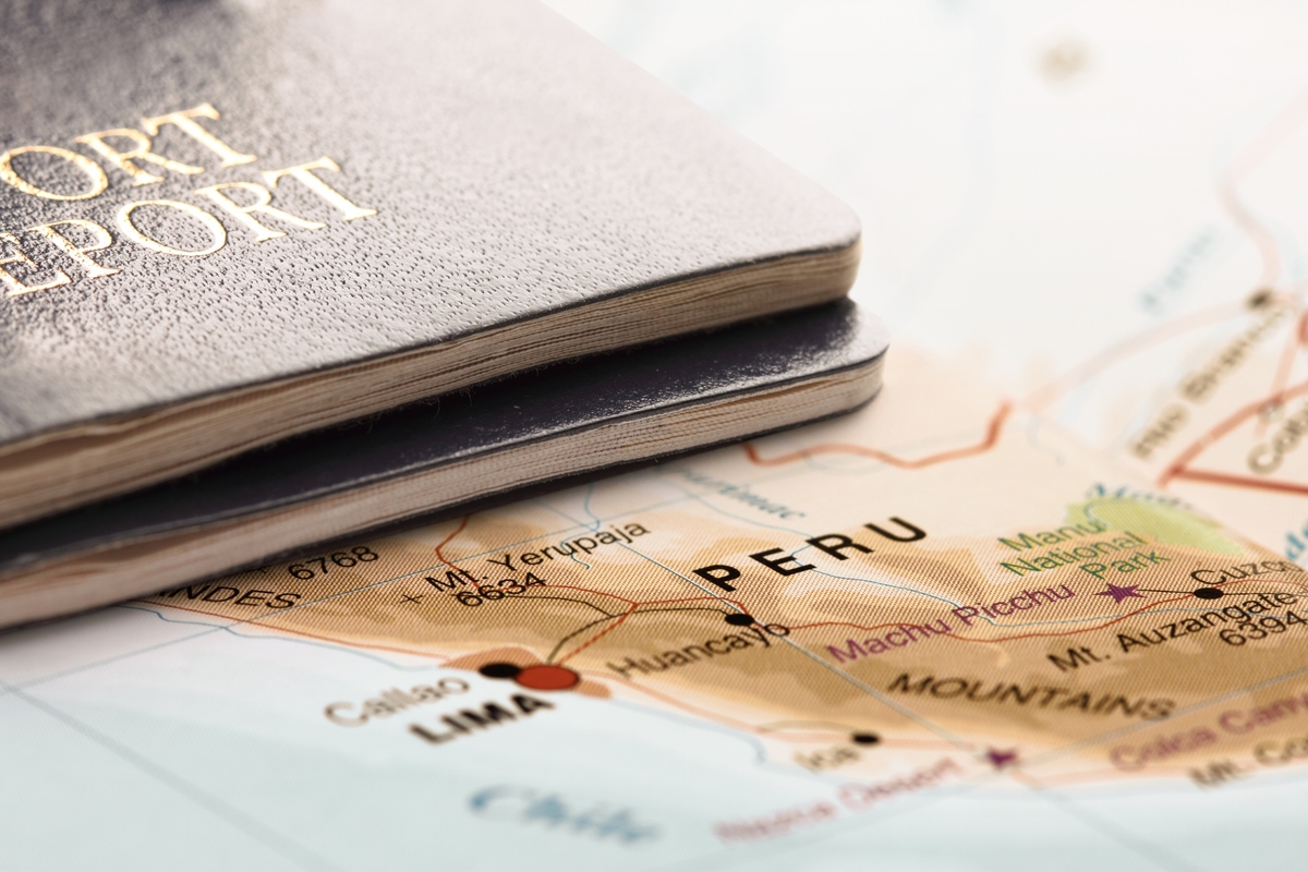 Destination Peru. Two passports on the map. Travel concept.
