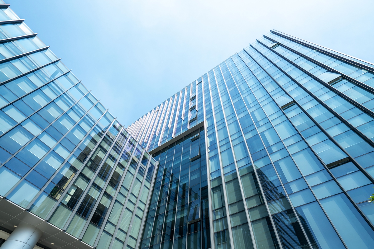 looking-up-blue-modern-office-building-2